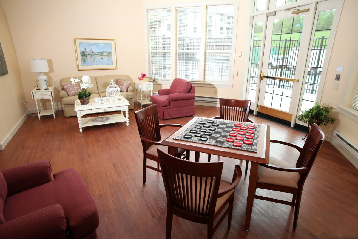 OVGH Sitting Area 3 Checkers Table, Couch, Large Windows