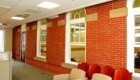 Point of Connection between addition and original, brick and carpet