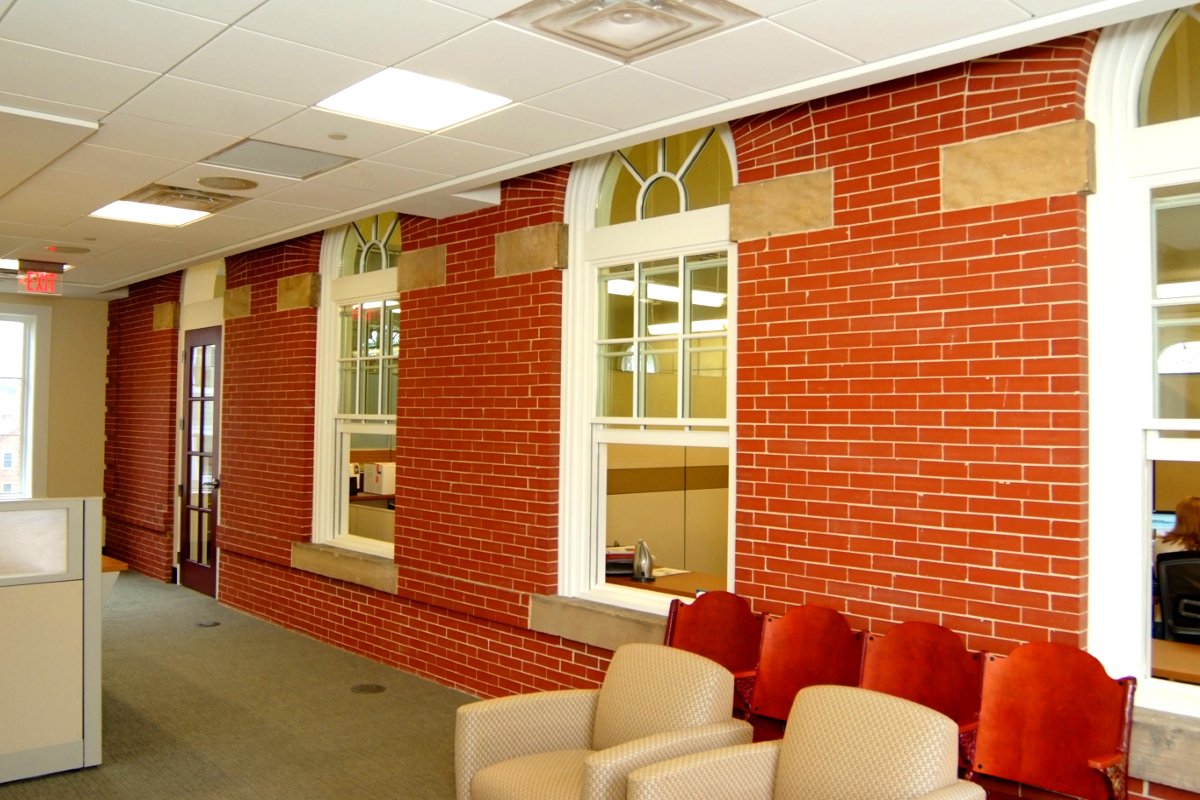 Point of Connection between addition and original, brick and carpet