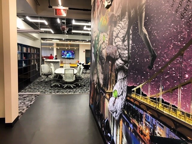 Custom artwork leads into a conference area